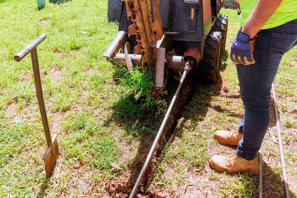 ER Plumbing technician working on trenchless repairs